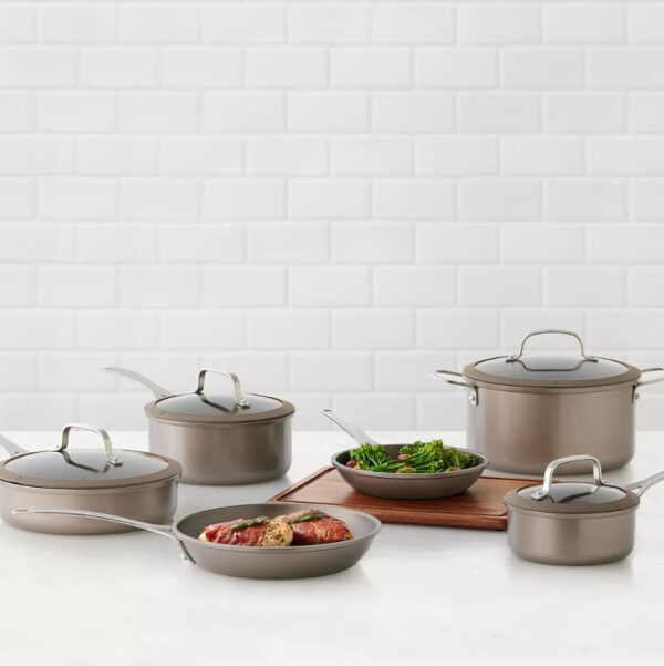 Food Network™ 10-pc. Textured Titanium Nonstick Cookware Set Features a diamond-shaped textured surface along with 2-coats of nonstick for excellent browning, food release and cleanup. Durable aluminum construction for fast and even heating; suitable for all stove tops except induction. Double-riveted stainless steel handles provide a strong and secure grip. Silicone-rimmed tempered glass lids allow you to monitor your food during the cooking process. 1.5-qt. sauce pan with lid 3-qt. sauce pan with lid 3-qt. saute pan with lid 6-qt. Dutch oven with lid 8-in. frypan 10-in. frypan Aluminum Dishwasher safe Oven safe to 350°F