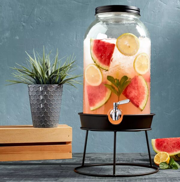 Mason Craft & More 11-Liter Glass Drink Dispenser with Metal Rack This 2.9 gallon Glass Drink Dispenser from Mason Craft & More delivers convenience and vintage style to your kitchen, whether you're serving fresh lemonade or homemade sangrias. Practical and easy to use, this drink dispenser includes a screw-top lid and wide mouth for simple filling with a leakproof, stainless-steel spigot. Glass is BPA-free, stain and odor-resistant Leakproof, stainless-steel spigot is easy to use and built to last Tight-fitting, screw-top lid keeps dust out and allows for quick refilling Adds vintage charm or modern farmhouse style to your kitchen design Ideal for showing off colorful drink creations at parties, serving water or lemonade in the backyard Vintage embossed design features the classic Mason Craft and More logo