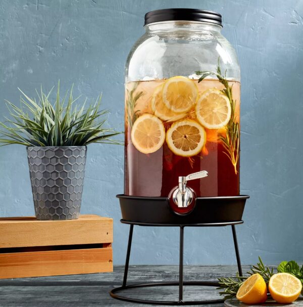 Mason Craft & More 11-Liter Glass Drink Dispenser with Metal Rack This 2.9 gallon Glass Drink Dispenser from Mason Craft & More delivers convenience and vintage style to your kitchen, whether you're serving fresh lemonade or homemade sangrias. Practical and easy to use, this drink dispenser includes a screw-top lid and wide mouth for simple filling with a leakproof, stainless-steel spigot. Glass is BPA-free, stain and odor-resistant Leakproof, stainless-steel spigot is easy to use and built to last Tight-fitting, screw-top lid keeps dust out and allows for quick refilling Adds vintage charm or modern farmhouse style to your kitchen design Ideal for showing off colorful drink creations at parties, serving water or lemonade in the backyard Vintage embossed design features the classic Mason Craft and More logo