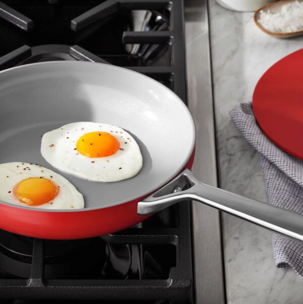 Ceramic Cookware Set Red 11-Piece Red Member's Mark Superior Nonstick Cookware Unlike traditional nonstick cookware, this set of pots and pans features ceramic nonstick interiors made without harmful chemicals like PTFE, PFOS or PFOA. Now you can enjoy superior nonstick performance with high release and easy cleaning after every meal. The impact-bonded honeycomb base makes this set safe for all stovetops, including induction. Plus, these pans are oven safe up to 450°F—talk about versatile! Nonstick Cooking with Less Oil and Butter The nonstick interiors of this cookware require little oil or butter while you're cooking for healthier meals that don't stick to the pans. The heavy-gauge aluminum construction delivers even heat distribution and long-lasting durability for years of cooking. Even Heating and Enhanced Flavor The specially designed cast aluminum lids have a curved shape for self-moistening circulation during cooking that protects food from drying out. The unique design gently cooks your dishes and enhances the flavors of the food during cooking. Care and Storage Dishwasher safe, though handwashing is recommended to extend the life of your cookware Pots, pans and lids are oven-safe to 450°F (232°C) Suitable for use on all cooktops, including induction To extend the life of your cookware, cook only on low to medium heat; never on extremely high heat as it can ruin the nonstick interiors