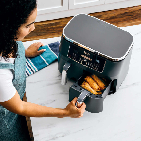 Ninja Foodi Air Fryer with DualZone Technology 6-in-1 10-qt. The Ninja® Foodi® 6-in-1 10-qt. XL 2-Basket Air Fryer with DualZone™ Technology and IQ Boost. This XL 10-qt. air fryer has 2 independent baskets that lets you cook 2 foods at once, no back-to-back cooking like a traditional single-basket air fryer. Ninja Foodi Air Fryer Product Features: The XL air fryer with 2 independent baskets that lets you cook 2 foods, 2 ways, at the same time, not back-to-back like a traditional single-basket air fryer. DualZone™ Technology includes the Smart Finish feature for cooking 2 foods 2 ways that finish at the same time, and the Match Cook feature, which easily copies settings across zones for full 10-qt. capacity. IQ Boost optimally distributes power across each basket to cook a 6-lb. whole chicken and side as quickly as possible when Match Cook or Smart Finish is not selected. 6 versatile cooking programs: Air Fry, Keep Warm, Roast, Bake, Reheat, and Dehydrate. XL 10-qt. capacity and 2 baskets, you can whip up a main and a side at the same time for quick large family meals, or up to 8 lbs. of chicken wings. 2 independent 5-qt. zones have their own cooking baskets, cyclonic fans, and rapid heaters. Easy-to-clean baskets and dishwasher-safe crisper plates. Wide temperature range: 105°F–400°F. Up to 75% less fat than traditional air frying methods. *Tested against hand-cut, deep fried French fries Cooks two 6-lb. chickens up to 30% faster than a traditional oven. Accessories Included: 1690-watt main unit with 6 programmable cooking functions Two 5-qt cooking baskets for 10-qt capacity 2 nonstick crisper plates 15 chef-inspired recipes & cooking charts Dimensions & More: Type of material: Plastic LxWxH: 17” Lx 13.9” x 13” Weight: 19.75 Lbs 1690-Watts, 120-Volts