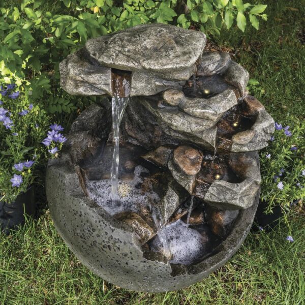 Enchanted Garden 23.62 inches Tiered Riverview Park Outdoor Water Fountain This spherical Riverview Park Water Fountain will add a beautiful dramatic element to your garden. The stepping stones of the waterfall portion of the fountain beckon you to come closer to absorb the peaceful sound it makes. Two pools of water are lit with LED lights, adding a warm glow to your fountain in a shady spot in your yard, or throughout the evening. Crafted from polyresin and fiberglass, it will last many years if stored safe from frost during the harshest Winter weather. Material Composite Flow Rate 290.62 gallon per hour Includes Warm white LED lights, Pump Capacity 2.95 gallon (US) Number of Tiers 7 Color/Finish Beige Dimensions 23.62 in H x 20.67 in W x 19.69 in D Weight 22 pounds Crafted of polyresin and fiberglass Includes 5 warm white LED lights Includes a 6 ft. power cord for the water pump For outside use only