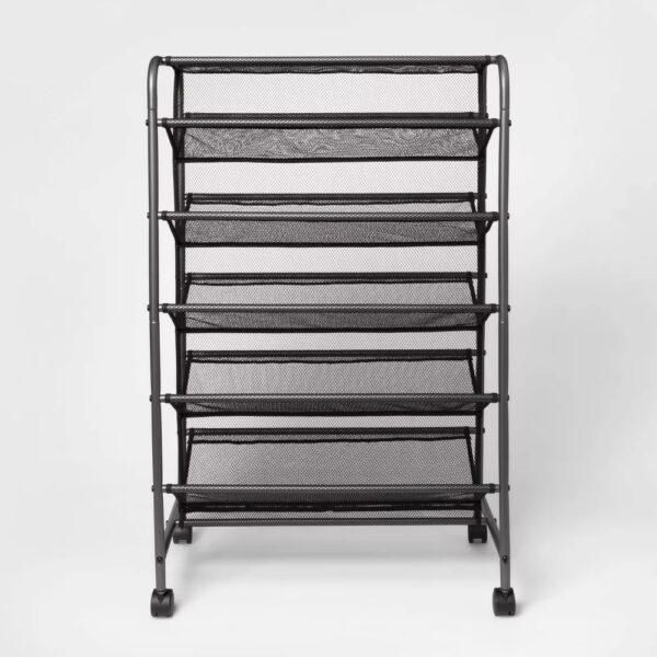 Double Sided Rolling Shoe Rack Black - Room Essentials™ Keep your shoes neatly organized and off the floor with the Double Sided Rolling Shoe Rack from Room Essentials™. Crafted from solid steel for durability and lasting use, this black metal shoe closet features a double-sided shelf design that can easily hold up to 30 pairs of shoes. The breathable mesh lining offers ample ventilation and keeps the shoes from falling out of the rack, while the attached rolling casters make it easy to move it from one room to another. Perfect for organizing men's, women's or kids shoes, this portable shoe closet offers ample space to accommodate different styles of shoes while easily blending with any style of decor.